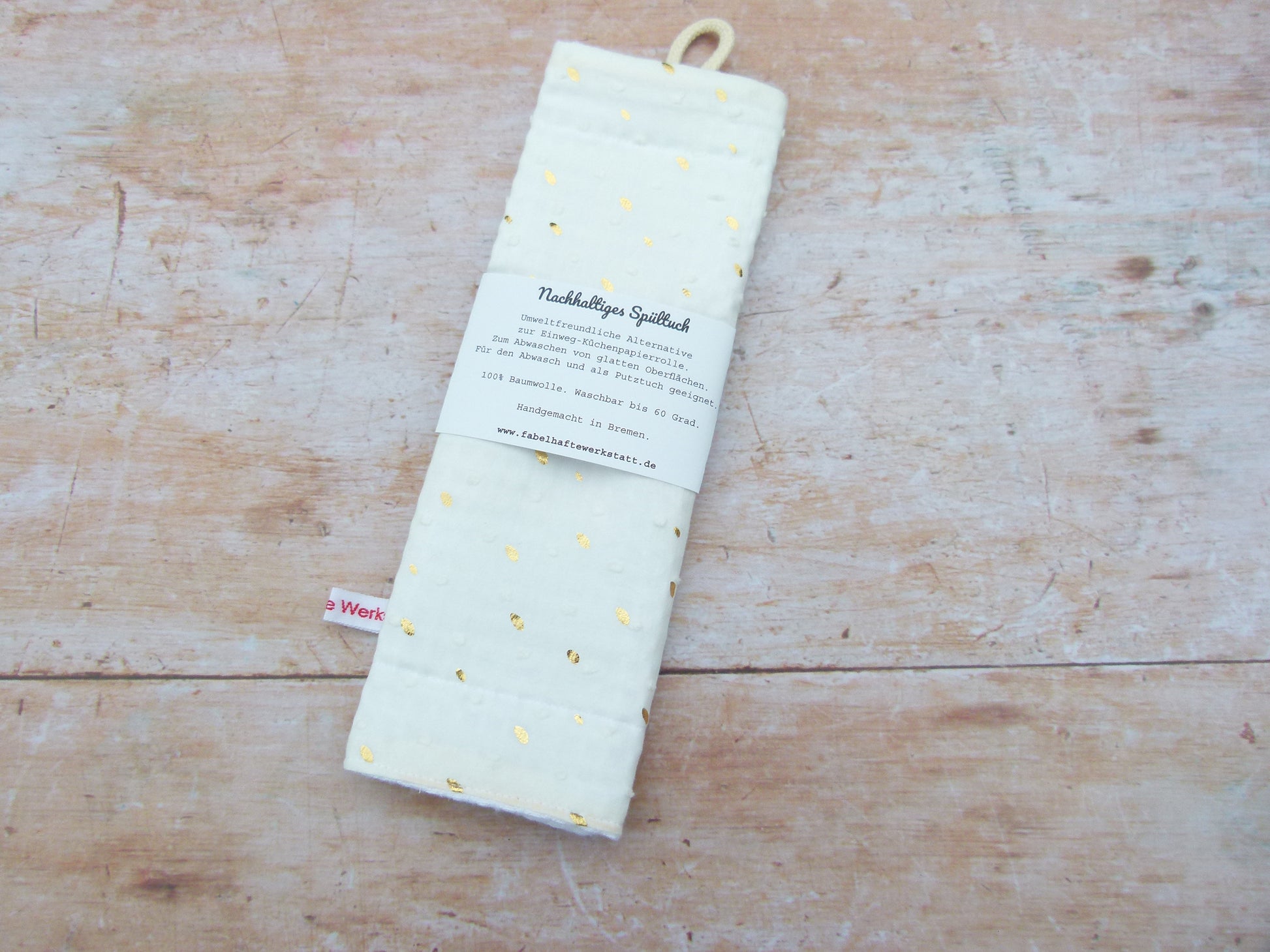 Nachhaltiges Spültuch in elegantem Cremeweiß mit goldenen Punkten von Fabelhaftewerkstatt.