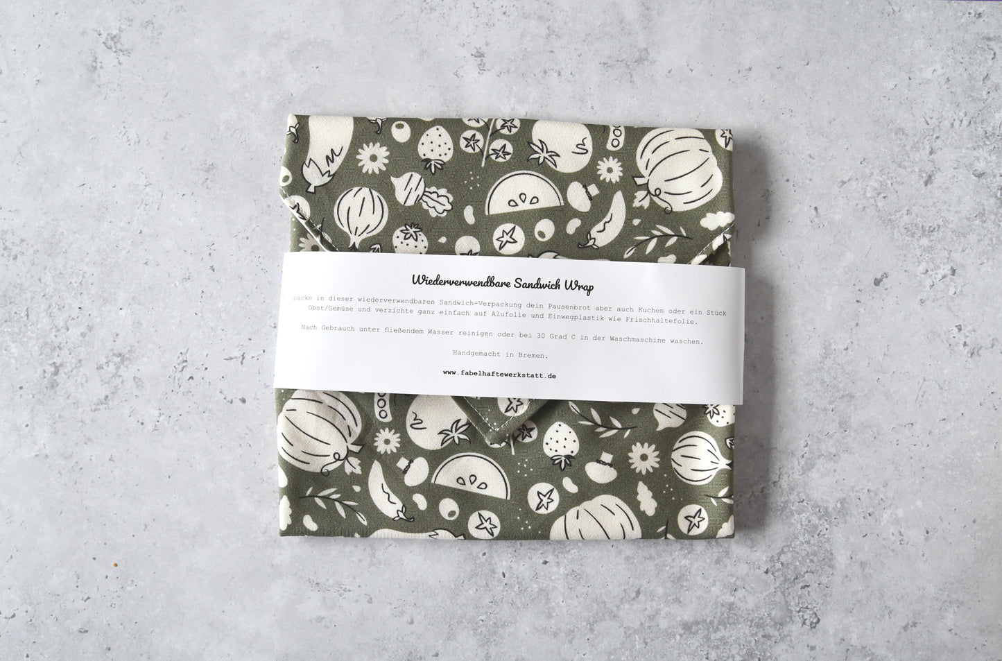 Geschlossener waschbarer Sandwich Wrap von Fabelhafte Werkstatt mit Papierbanderole und Produktbeschreibung.