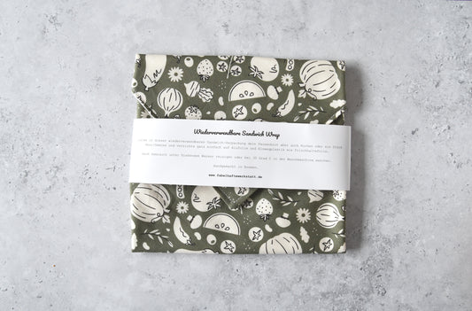 Geschlossener waschbarer Sandwich Wrap von Fabelhafte Werkstatt mit Papierbanderole und Produktbeschreibung.