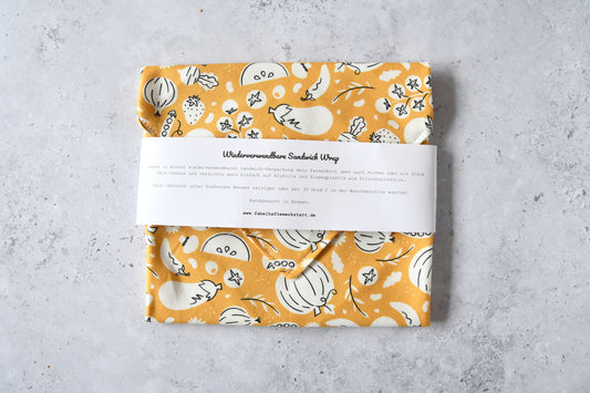 Geschlossener waschbarer Sandwich Wrap von Fabelhafte Werkstatt mit Papierbanderole und Produktbeschreibung.