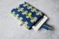 Preview: eBook-Reader-Tasche "Grafische Retroblumen auf blau"