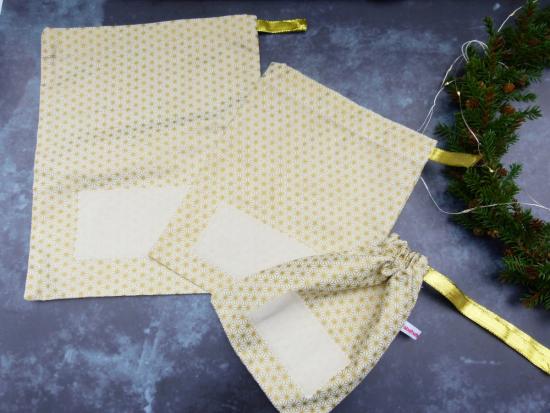 Geschenkbeutel (Sternenmuster gold)